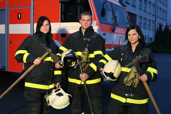 Firefighter and girls — Stock Photo, Image