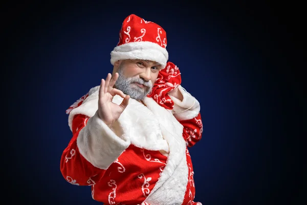 Santa Claus with dollars on a white background — Stock Photo, Image