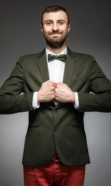 Happy young man in a green suit — Stock Photo, Image