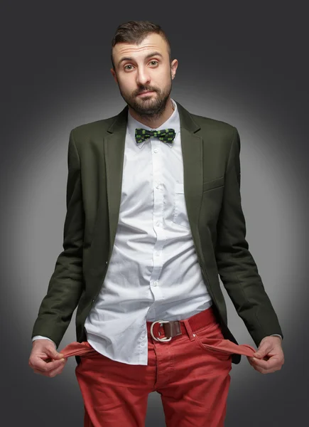 Νεαρός άνδρας σε ένα πράσινο κοστούμι, κανένα χρήμα — Φωτογραφία Αρχείου