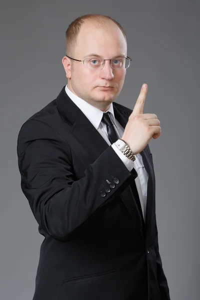 Businessman showing sign of attention — Stock Photo, Image