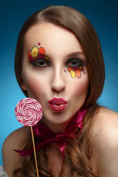 Young model eting lollipop — Stock Photo, Image