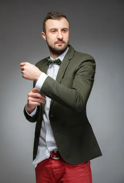 Portrait of handsome stylish man in elegant green suit. — Stock Photo, Image