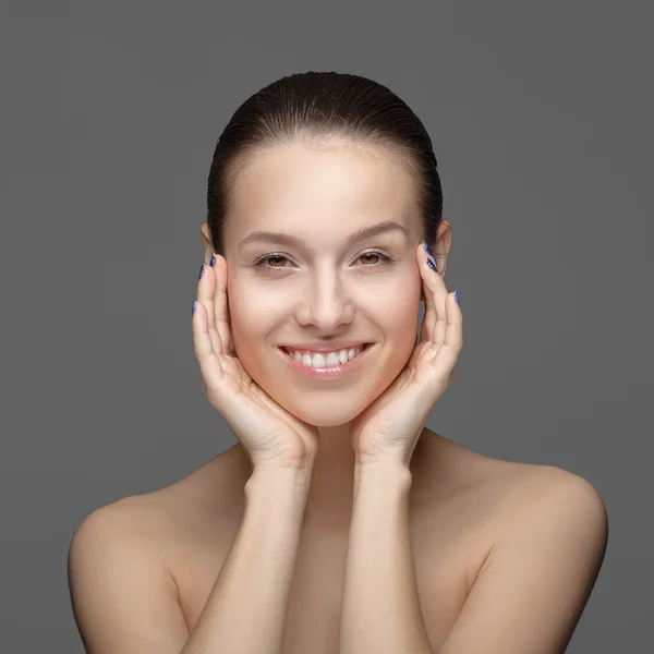 Woman touching face — Stock Photo, Image