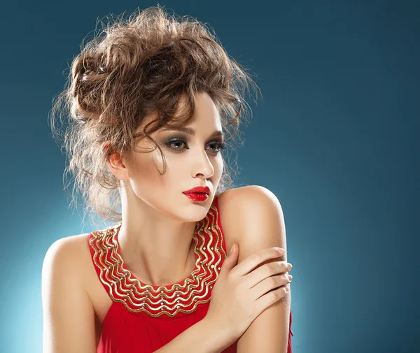 Beauty Portrait. Beautiful girl in red dress and fashionable hai — Stock Photo, Image