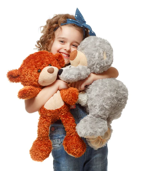 Little girl holding a teddy bear. Isolated on white background — Stock Photo, Image