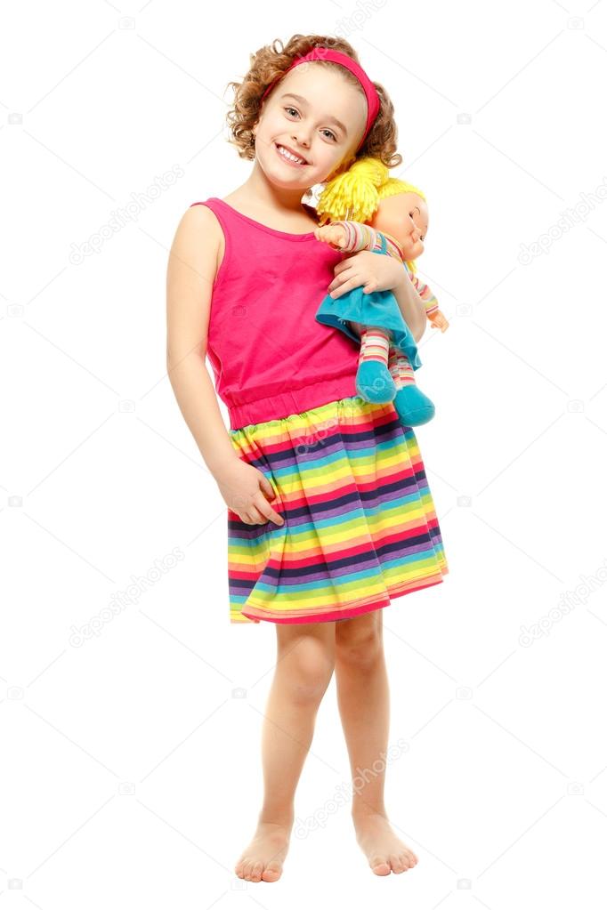 little girl holding doll