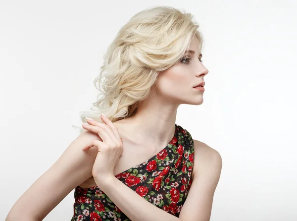 Beauty portrait of a beautiful blonde in a black dress with red — Stock Photo, Image