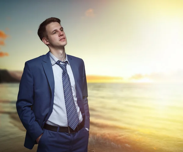 Office worker on the beach during sunset. — Stock Photo, Image