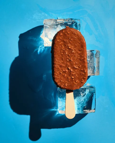 Chocolate Nut Ice Cream Ice Cubes Blue Background Sunlight Summer — Stock Photo, Image