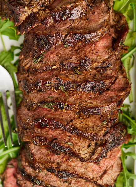 Grilled sliced beef steak. Beef tenderloin steak. Filet Mignon recipe. Top view. Macro. Close up.