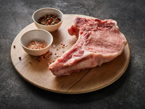 Raw fresh pork chop. Raw pork cutlet. Organic pork loin chops. Close-up.
