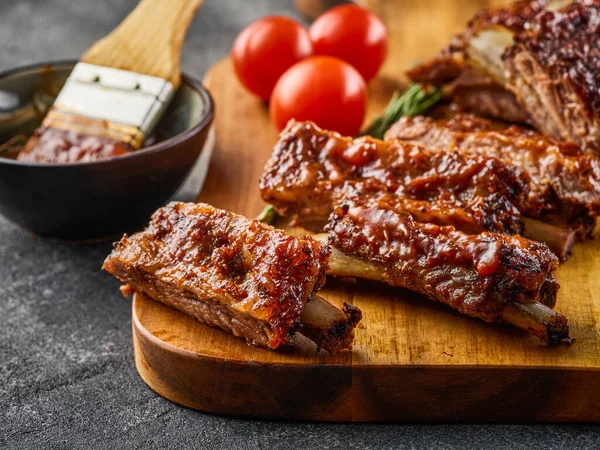 Barbecued and marinated sticky spare ribs. Grilled spare ribs. American style pork ribs.