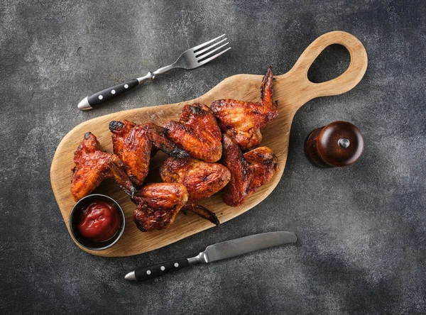 Grilled spicy chicken wings with ketchup. Spicy Homemade Buffalo Wings top view