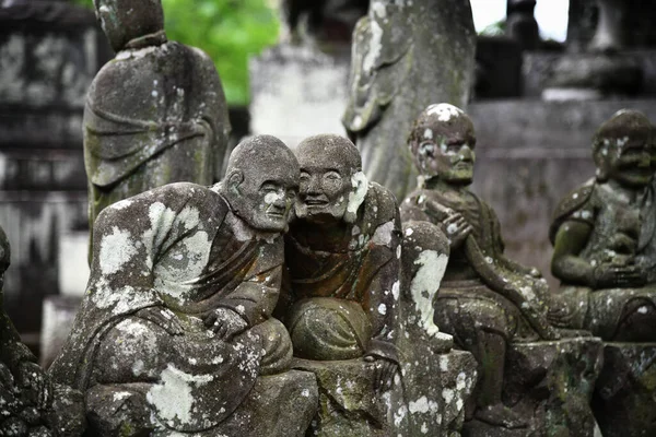Ancient stone statues of Rakan at Kita-in Temple in Kawagoe, Saitama, Japan. Each statue shows a different character and expression.