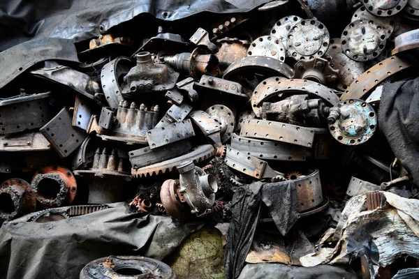 Pile of old machine parts and car spare parts. Rusty and corroded machine parts and car spare parts at Talad Noi, Bangkok, Thailand.