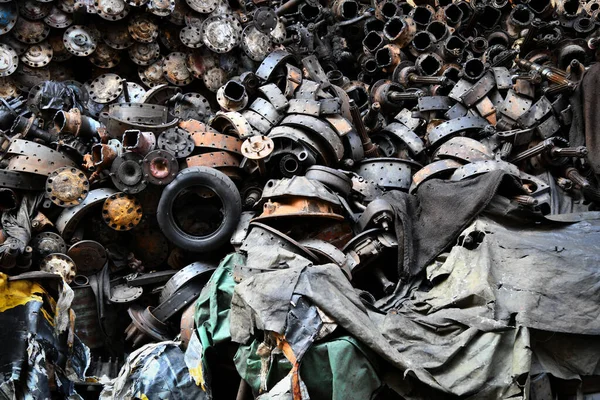Pile of old machine parts and car spare parts. Rusty and corroded machine parts and car spare parts at Talad Noi, Bangkok, Thailand.
