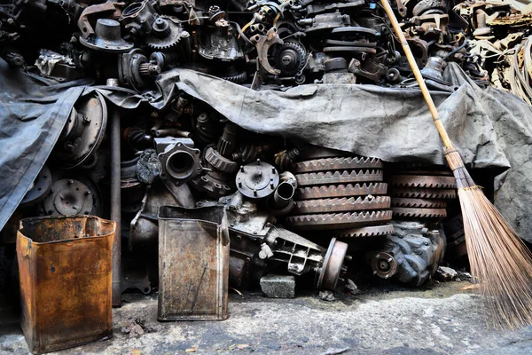 Pile of old machine parts and car spare parts. Rusty and corroded machine parts and car spare parts at Talad Noi, Bangkok, Thailand.