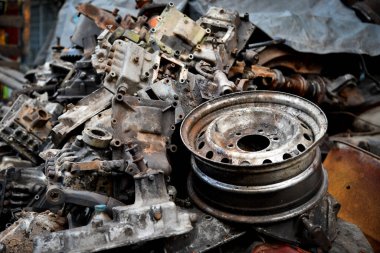Pile of old machine parts and car spare parts. Rusty and corroded machine parts and car spare parts at Talad Noi, Bangkok, Thailand.