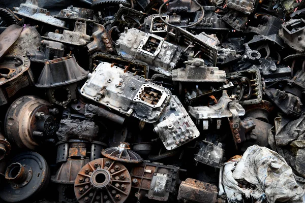 Pile of old machine parts and car spare parts. Rusty and corroded machine parts and car spare parts at Talad Noi, Bangkok, Thailand.