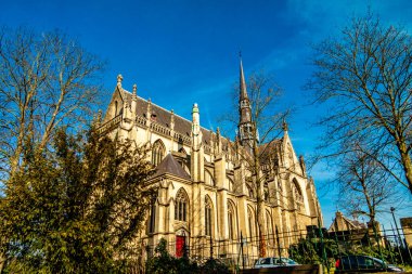 Side view of the Basilica of the Blessed Sacrament or Basilica of Meerssen from a lower perspective, wonderful winter day in the Proosdij park in south Limburg in the Netherlands Holland