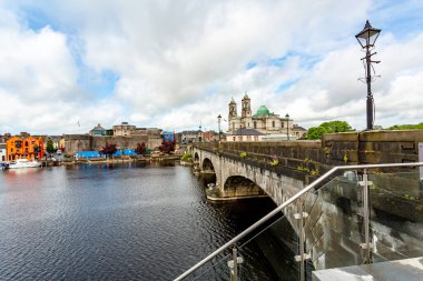 Beautiful view of the bridge over the river Shannon, the parish church of Ss. Peter and Paul and the castle in the town of Athlone, wonderful day in the county of Westmeath Ireland