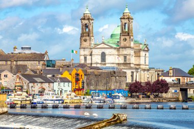 Beautiful view of the parish church of Ss. Peter and Paul and the castle in the town of Athlone next to the river Shannon, wonderful cloudy day in the county of Westmeath, Ireland