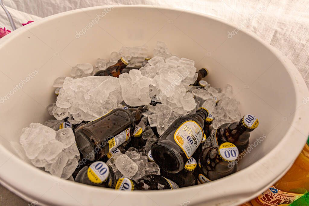 Beek, South Limburg, Netherlands. September 15th. 2019. Bottles of Bitburger Non-Alcoholic Beer 0.0 in an ice bucket at a family event, refreshing drink on a hot summer day