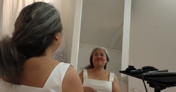 Mature Woman Looking Herself Front Mirror Untying Her Long Gray — Stockvideo