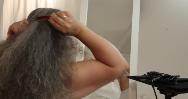 Mature Woman Starting Part Her Loose Grey Black Wavy Hair — Stockvideo
