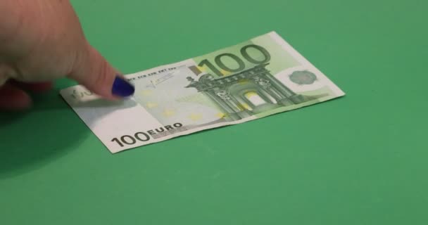 Adult Female Hands Placing 100 Euro Bills Surface Green Studio — Stockvideo