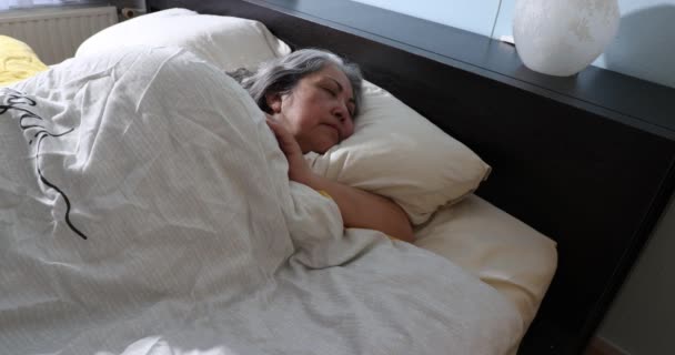 Mature Woman Sleeping Peacefully Slowly Waking Feeling Sunlight Coming Window — Stock Video