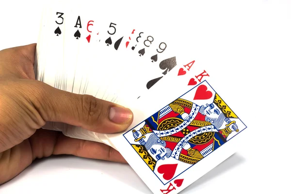 Gra w karty w ręku na białym tle — Zdjęcie stockowe