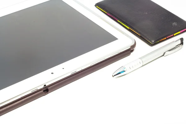 Empty tablet and notebook with a pen isolated