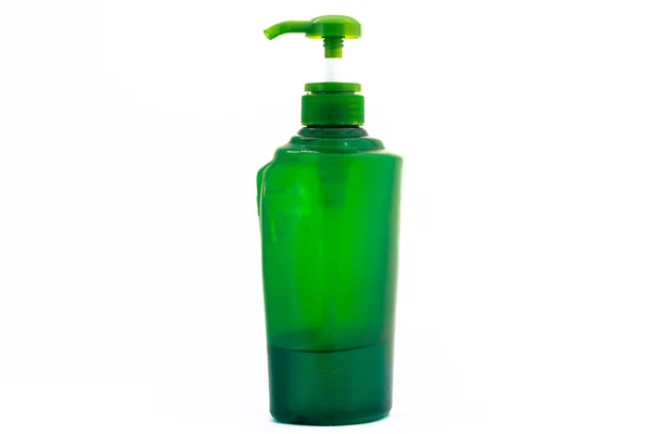 Green lotion bottle , comprising bottle isolated — Stock Photo, Image