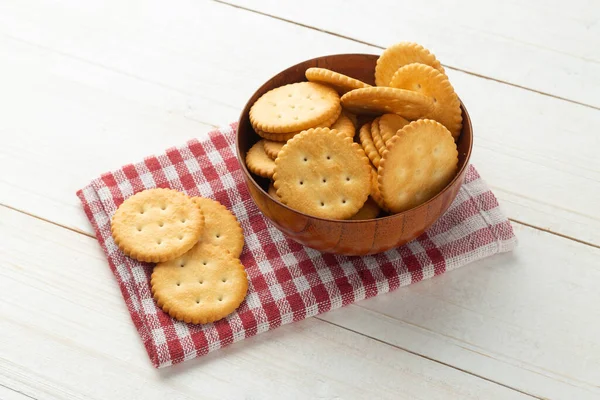 Rounded Cracker Cookies Wooden Bowl Tablecloth White Wooden Table Background — Stock Photo, Image