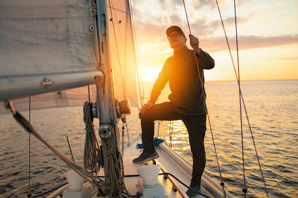 Men on a yacht during Sunset in the Baltic Sea