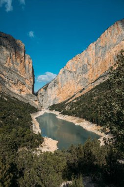 Beautiful landscape of gorge with river and forest. Congost de Mont Rebei, Catalonia, Spain. clipart
