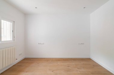 Empty white room with window and natural light. Interior of the freshly renovated room