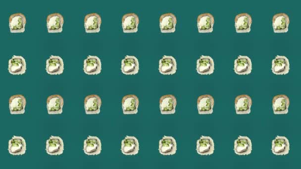 Colorful pattern of japanese sushi rolls on green background. Seamless pattern with sushi. Philadelphia rolls. Top view. Realistic animation. 4K video motion — Video Stock