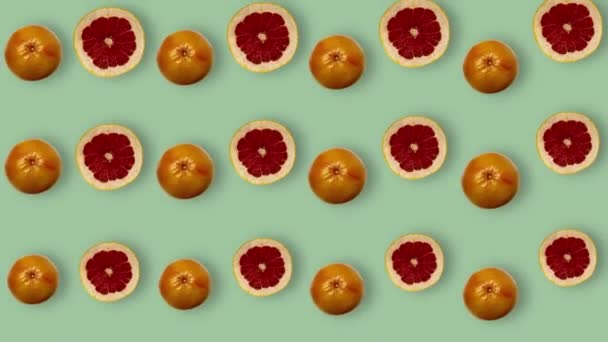Färgrikt mönster av färska grapefrukter. Högst upp. Sömlöst mönster med grapefrukt skivad. Popkonst design. Realistisk animation. 4K-videoverk — Stockvideo