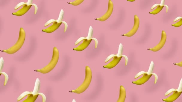 Modèle de fruits colorés de bananes jaunes fraîches sur fond rose avec des ombres. Modèle sans couture avec banane. Animation réaliste. Mouvement vidéo 4K — Video