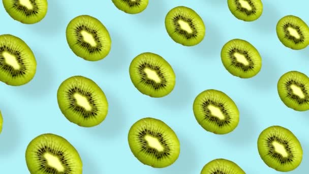 Colorful fruit pattern of fresh kiwi on blue background with shadows. Seamless pattern with kiwi sliced. Realistic animation. 4K video motion — Stock Video