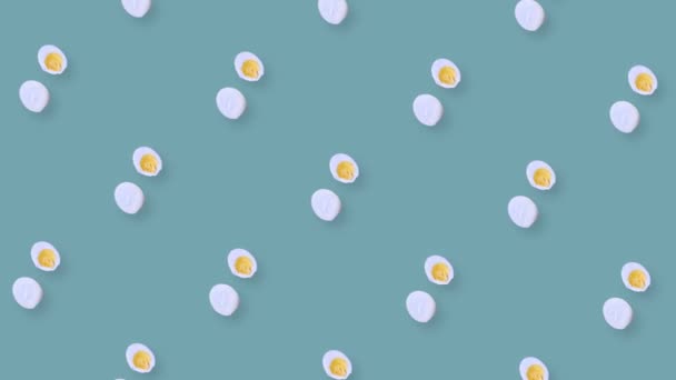 Colorful pattern of rotating chicken eggs. Pop art design. Seamless pattern with egg. Top view. Realistic animation. 4K video motion — Stock Video