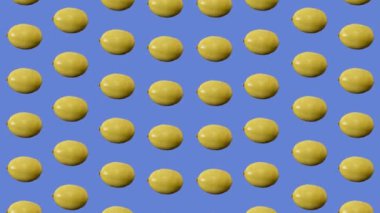Taze limon renkli meyve deseni. Limonlu kusursuz desen. Pop sanat tasarımı. Gerçekçi animasyon. 4K video hareketi