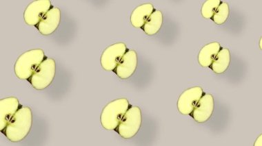 Taze elmaların renkli deseni. Üst Manzara. Elma dilimli kusursuz desen. Pop sanat tasarımı. Gerçekçi animasyon. 4K video hareketi