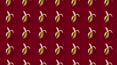 Kırmızı arka planda taze sarı muzların renkli meyve desenleri. Muzla kusursuz desen. Gerçekçi animasyon. 4K video hareketi