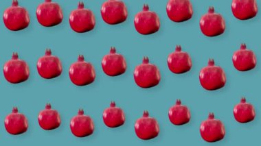 Renkli taze nar deseni. Minimum tropikal meyve konsepti. Kırmızı nar ve pürüzsüz desen. Pop sanat tasarımı. Gerçekçi animasyon. 4K video hareketi