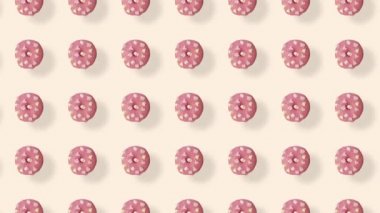 Pembe arka planda gölgeli izole edilmiş renkli çörek deseni. Donutla kusursuz desen. Çörekler. Üst Manzara. Gerçekçi animasyon. 4K video hareketi