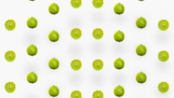 Modèle coloré de citrons verts. Vue de dessus. Minimal concept d'été de fruits tropicaux. Motif sans couture avec du citron vert tranché. Animation réaliste. Mouvement vidéo 4K — Video
